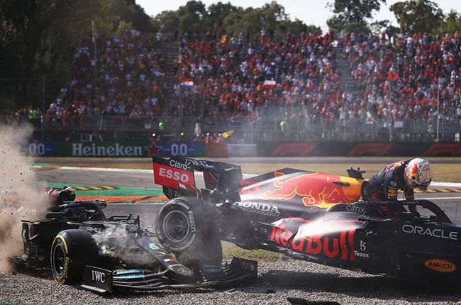 Max Verstappen of the Netherlands driving the (33) Red Bull Racing RB16B Honda climbs from his car after crashing during the F1 Grand Prix of Italy at Autodromo di Monza on September 12, 2021 in Monza, Italy. 