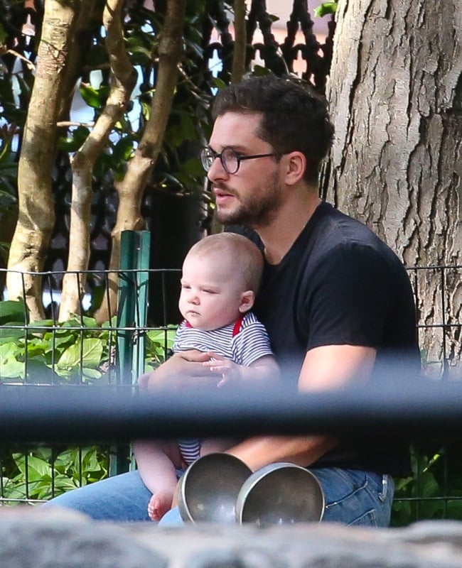 Kit looked every inch the doting father as he step