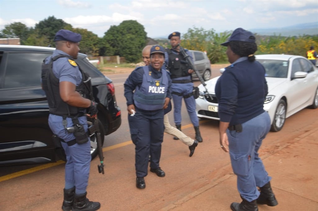 Lieutenant-General Semakaleng Manamela with police during the arrest of the suspect. Photo by Oris Mnisi 