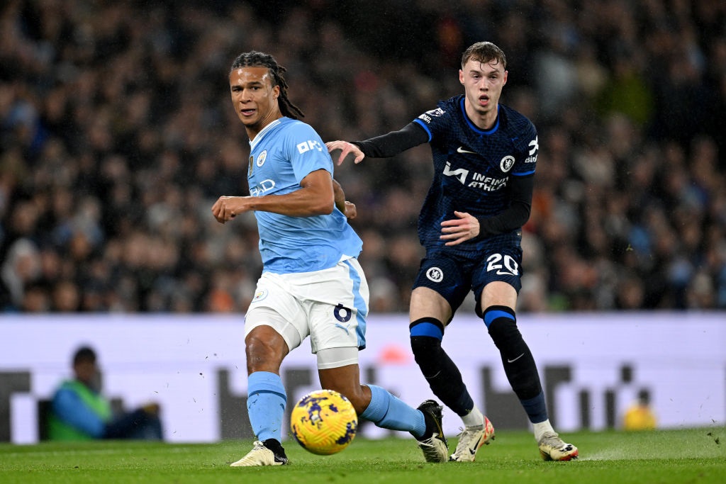 MANCHESTER, ENGLAND - FEBRUARY 17: Nathan Ake of Manchester City passes the ball whilst under pressure from Cole Palmer of Chelsea during the Premier League match between Manchester City and Chelsea FC at Etihad Stadium on February 17, 2024 in Manchester, England. (Photo by Darren Walsh/Chelsea FC via Getty Images)
