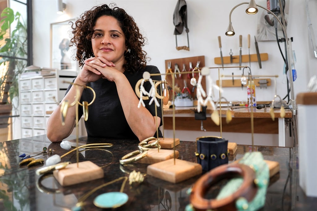 Kenyan designer Ami Doshi Shah, with some of her eclectic jewelry pieces at her home studio, where she creates eclectic hand-made jewelry using locally sourced raw materials varying among semi-precious stones and metals, in Nairobi on 16 February 2024. (Tony Karumba/AFP)