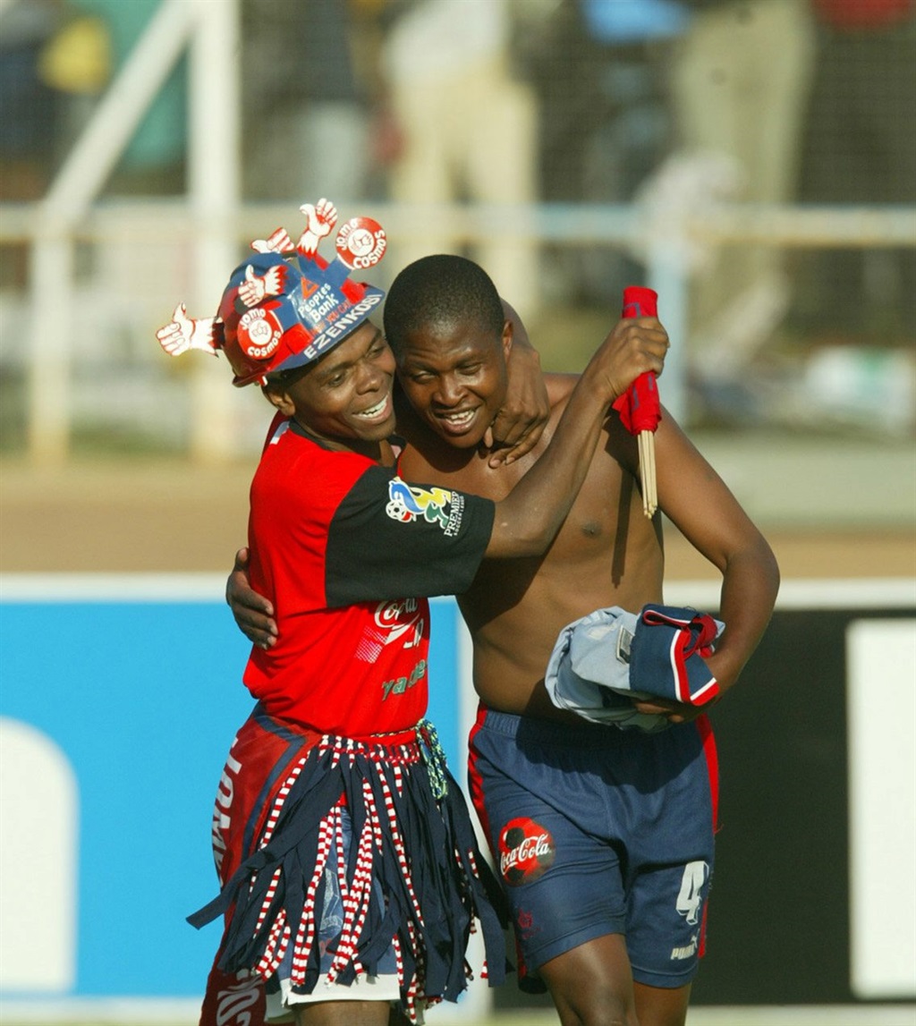 17 November 2002, Coca Cola Cup, Manning Rangers v Jomo Cosmos, Semi-Final, HM Pitjie Stadium, Pretoria, South Africa. A Cosmos fan hugs Innocent Ntsume, Photo Credit: - Gallo Images