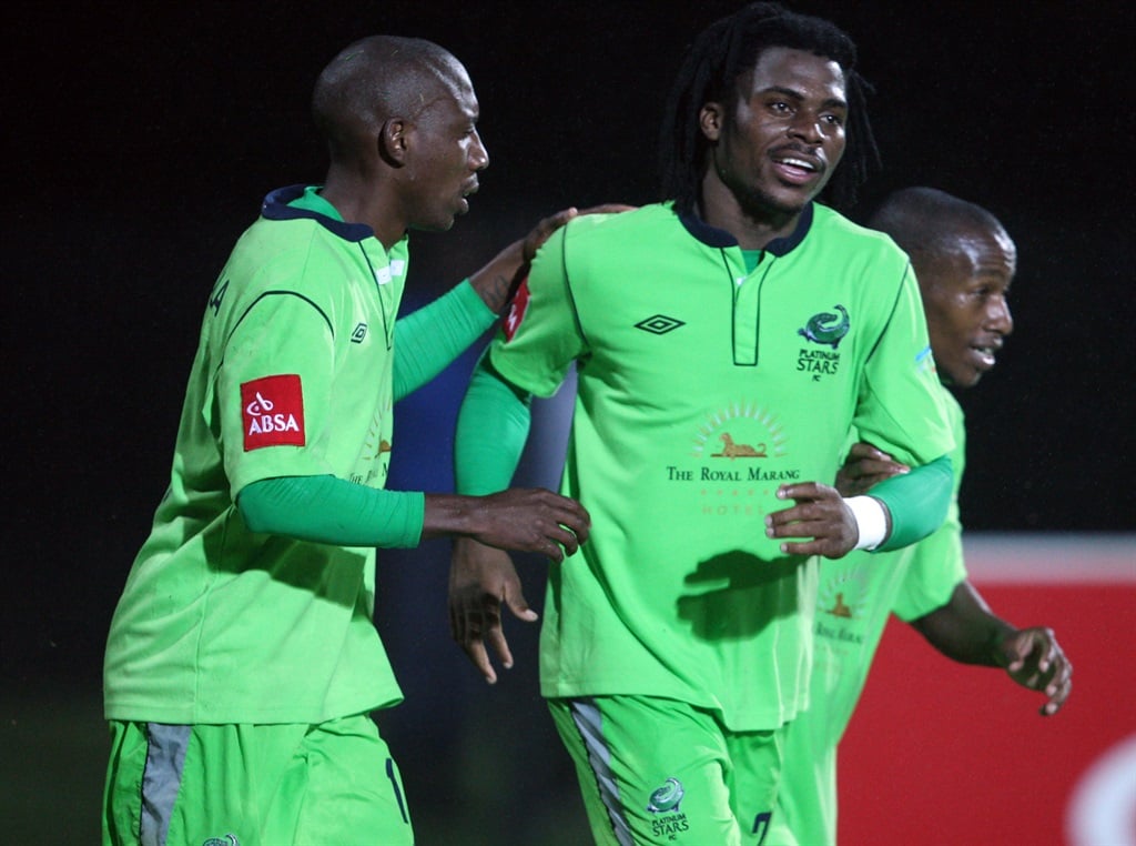 DURBAN, SOUTH AFRICA - DECEMBER 04, Platinum Stars players celebrating with Enocent Mkhabela  after scoring his goal during the Absa Premiership match between Maritzburg United and Platinum Stars at Harry Gwala Stadium on December 04, 2012 in Durban, South Africa