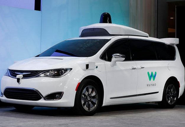 <b>WAYMO TO HIT THE ROAD:</b> A Chrysler Pacifica hybrid outfitted with Waymo's suite of sensors and radar is shown at the North American International Auto Show in Detroit. <i>Image: AP / /Paul Sancya</i>