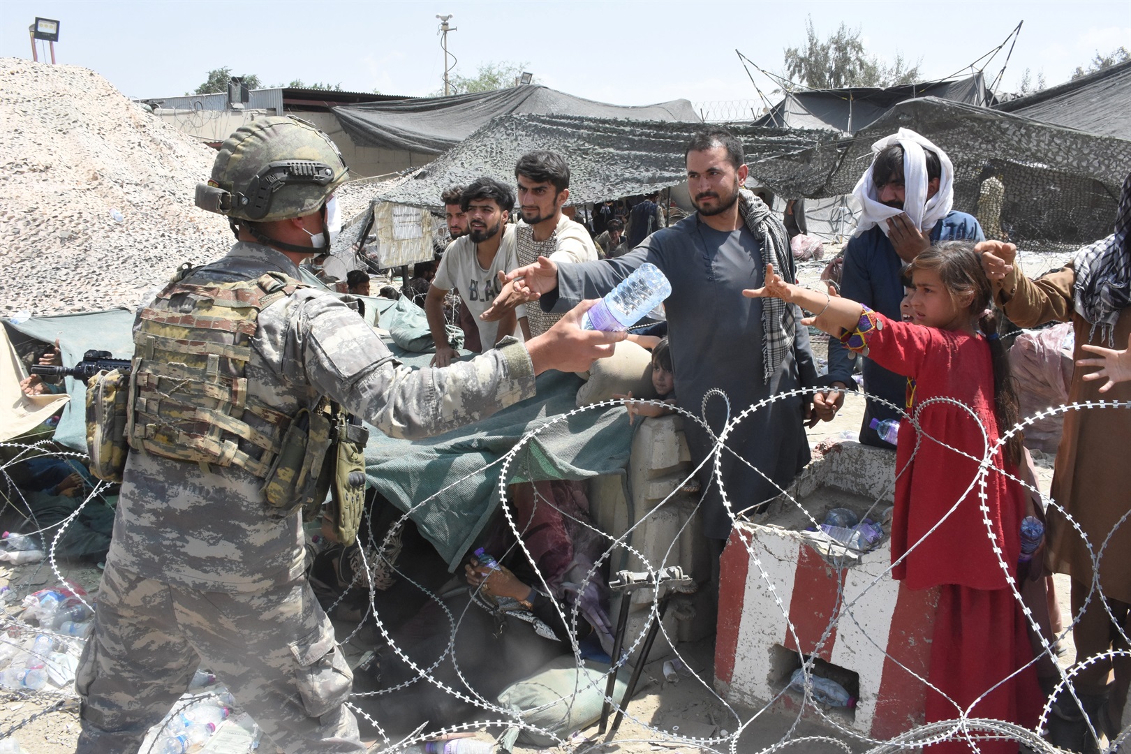 Soldiers from the Turkish Task Force in Afghanistan helping to coordinate the evacuation of refugees.  