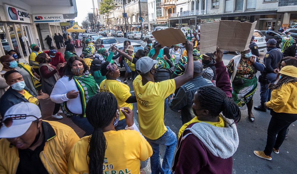 Community members from Khayelitsha, Mfuleni and Makhaza picket outside the ANC provincial office on Adderley Street, Cape Town, on Thursday. It is reported that the group protested about ward council elections in their area. Photo: Gallo Images/Brenton Geach)