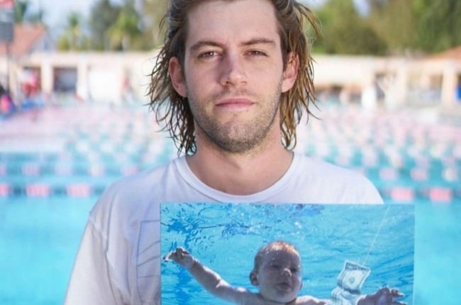 Spencer Elden holds the Nirvana cover that features him as a baby. (PHOTO: Instagram/ @spencer_elden_nirvana)