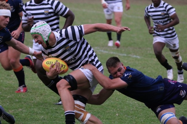 Jeppe Boys’ High School flanker Nathan Claasen is tackled by his opposite number from Grey College Juliun Cosmo, with Grey’s halfback Philip McLaren in close attention during their titanic clash at the Noord-Suid Rugby Tournament at Affies in Pretoria on Monday (Jeppe High School for Boys Facebook page)