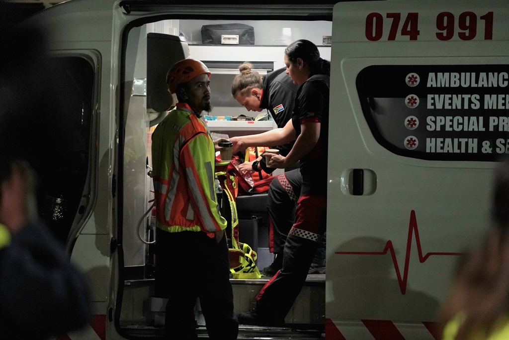 Medical personnel assist survivors pulled from the rubble in George. (Luke Daniel/News24) 