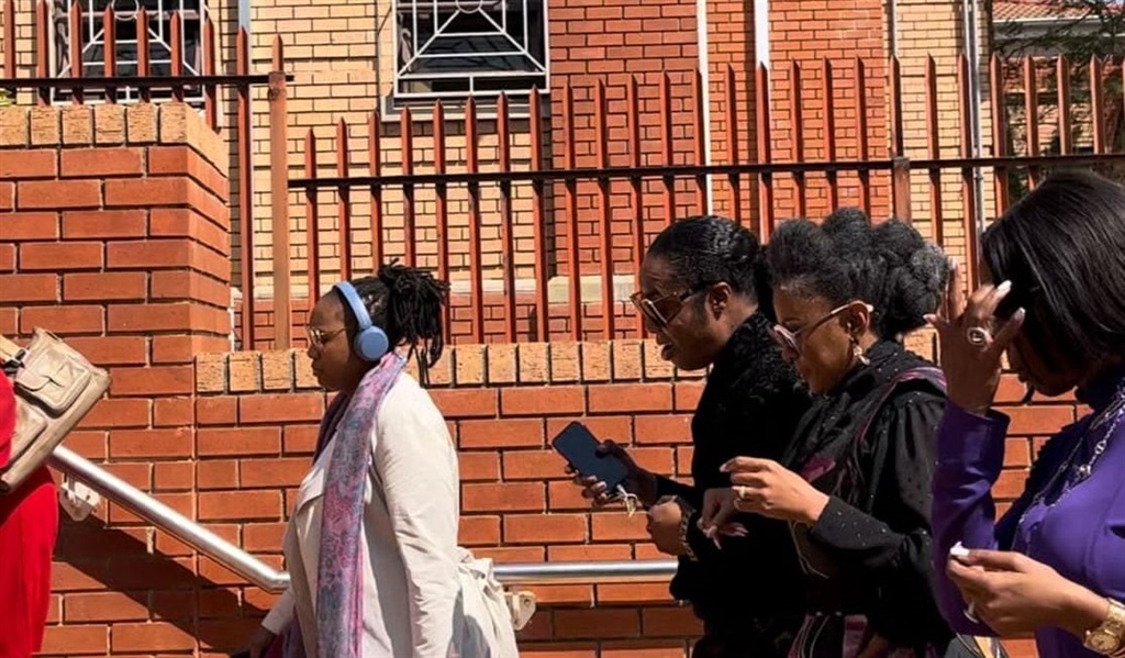 Author Jackie Phamotse was followed by Basetsana Kumalo before a court appearance. photo by Phuti Mathobela
