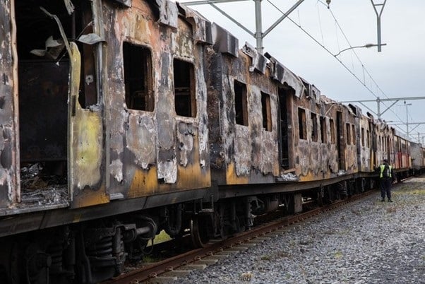 A burnt out train at the Paarden Eiland depot in Cape Town. Corruption at Prasa has almost destroyed commuter rail in the city, and Parliament's Standing Committee on Public Accounts is calling for the board members who oversaw the rail agency's destruction to face consequences. (GroundUp/Archive photo: Ashraf Hendricks)