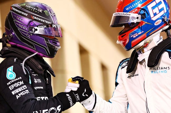 Race winner Lewis Hamilton of Great Britain and Mercedes GP is congratulated by George Russell of Great Britain and Williams in parc ferme during the F1 Grand Prix of Bahrain at Bahrain International Circuit on March 28, 2021 in Bahrain, Bahrain. 