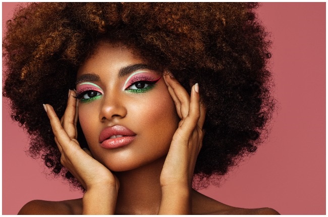Woman rocking a bright make-up look.