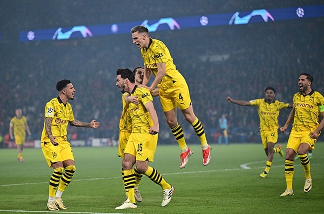 Dortmund's German defender Mats Hummels celebrates with teammates after scoring during the UEFA Champions League semi-final. (Miguel MEDINA / AFP)