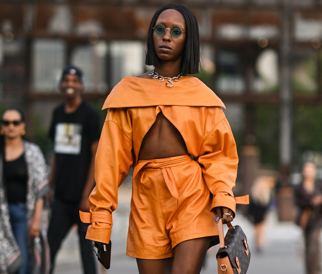 Dalia Drake is seen wearing an orange top and shorts and baby blue heels with a Louis Vuitton bag outside the Proenza Schouler show during New York Fashion Week S/S 22 on September 08, 2021 in New York City. (Photo by Daniel Zuchnik/Getty Images)