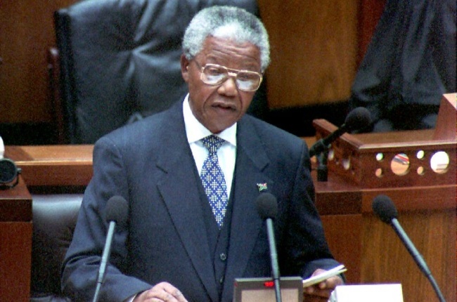 South African President Nelson Mandela outlines his vision for the new South Africa as he opens the first session of the country's first all-race parliament in Cape Town, 1994, 24 May 1994. President Mandela promised immediate help for impoverished blacks and told whites that they will be protected from retribution.