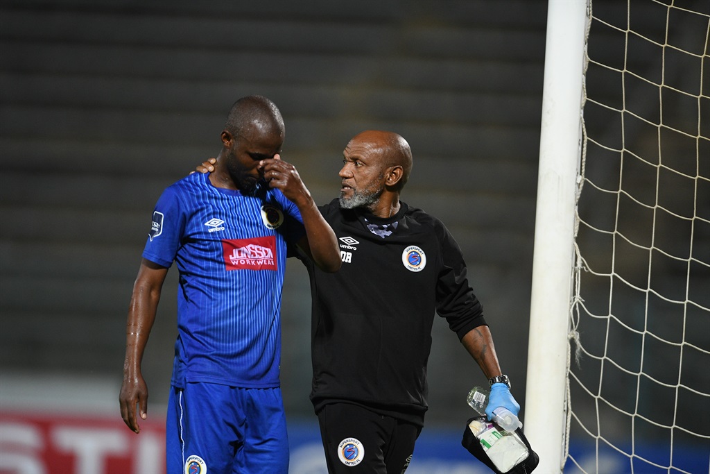 PRETORIA, SOUTH AFRICA - FEBRUARY 16:  Terrence Dzvukamanja of  SuperSport United and Dr Ntlopi Mogoru during the DStv Premiership match between SuperSport United and Stellenbosch FC at Lucas Moripe Stadium on February 16, 2024 in Pretoria, South Africa. (Photo by Lefty Shivambu/Gallo Images)