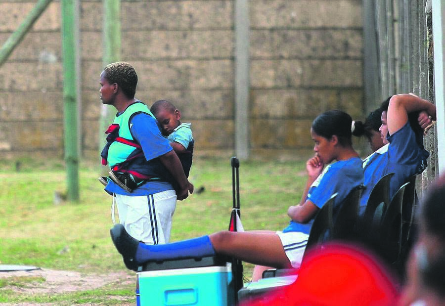 Fikiswa Xholo during a match with her son on her back. Photo: Rashied Isaacs