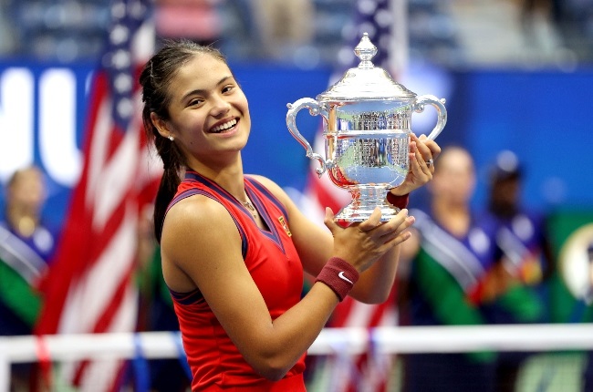 Emma Raducanu holds her US Open trophy. The teen says she plans on using her prize money to buy a pair of Apple AirPods - she lost her pair in the run-up to the tournament. (PHOTO: Getty Images/ Gallo Images)