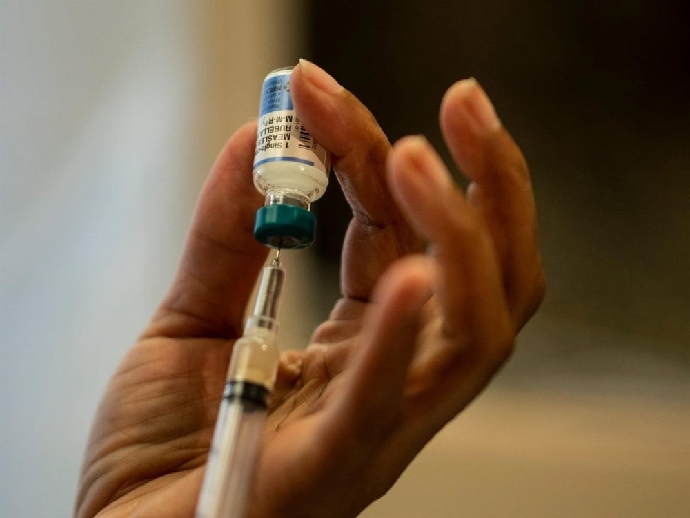 A nurse prepares the measles, mumps and rubella (MMR) vaccine. (Johannes Eisele/AFP via Getty Images)