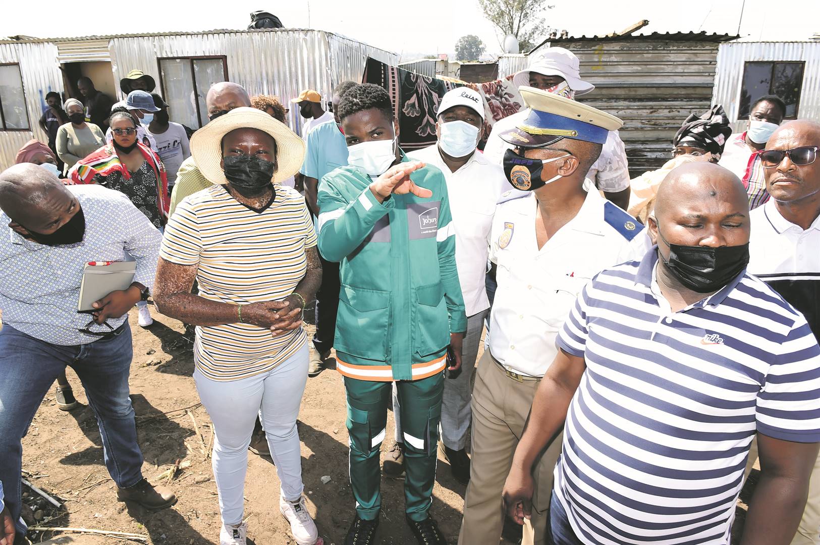 Housing MMC Mlungisi Mabaso (second from left, front) recently spoke to Chicken Farm residents in Kliptown on how to formally restructure their area, and the challenges faced by foreigners.                Photo by Morapedi Mashashe