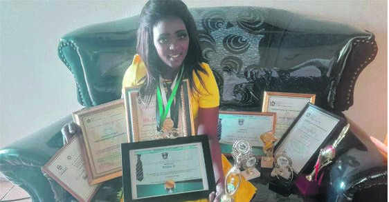 Mandisa Mtolo with some of her awards and appreciation certificates she has obtained as a teacher.