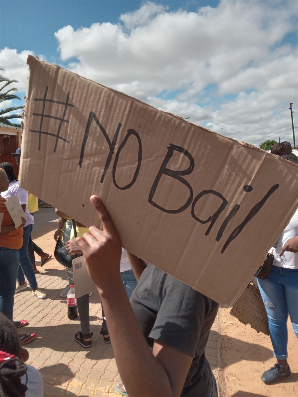 Residents of Dertig in Hammanskraal demonstrated outside the court, saying they want Moretele Magistrates Court to deny all suspects bail. Photo by Thokozile Mnguni