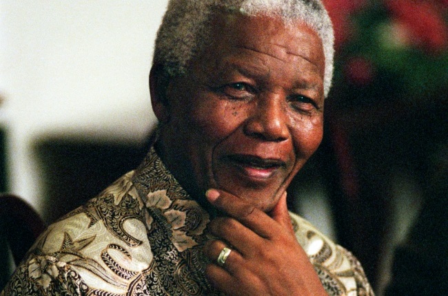 Former President Nelson Mandela of South Africa speaks to visitors on March 8, 1999 in his residence in Houghton, a suburb of Johannesburg, South Africa. The ANC freedom fighter was in prison for 27 years and released in 1990. He became President of South Africa after the first multiracial democratic elections in April 1994. Mr. Mandela retired after one term in 1999 and gave leadership to the current president Mr. Thabo Mbeki.