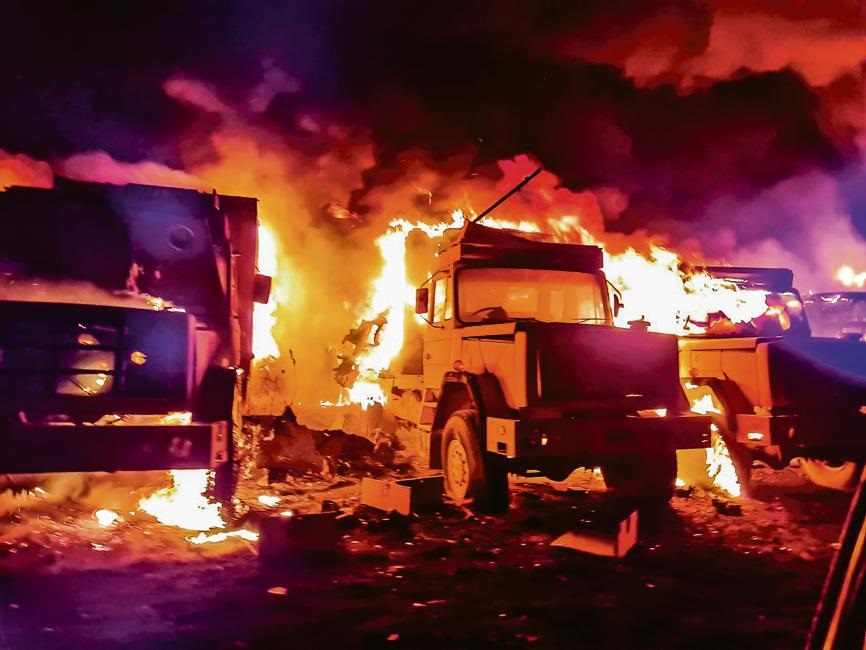 Army vehicles in flames on Thursday night. Photo: Supplied