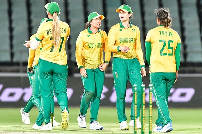 Proteas women's Sune Luus, Laura Wolvaardt and Chloe Tryon celebrating a wicket in a T20I. (Sydney Seshibedi/Gallo Images)
