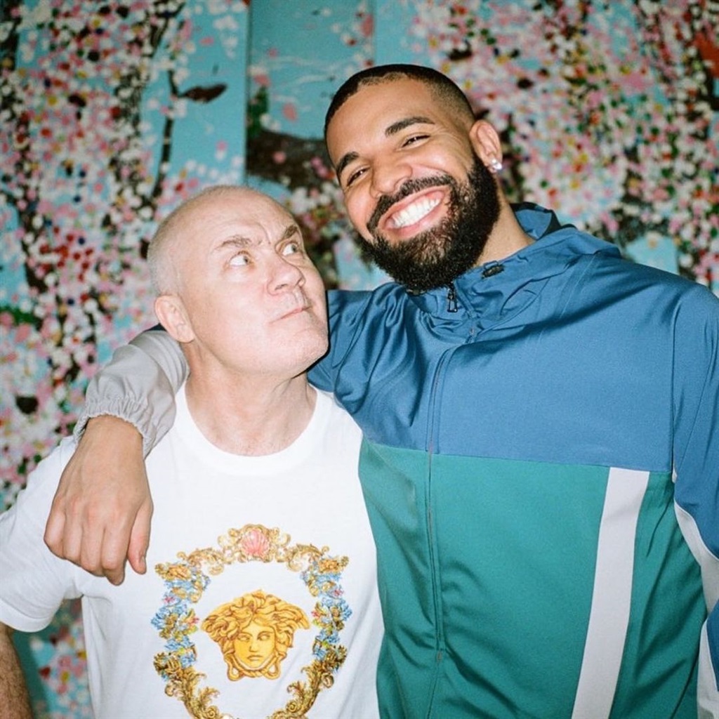 Drake and Damien Hirst stand in front of one of Hirst's studies of cherry blossoms. (Champagne Papi/ Instagram)