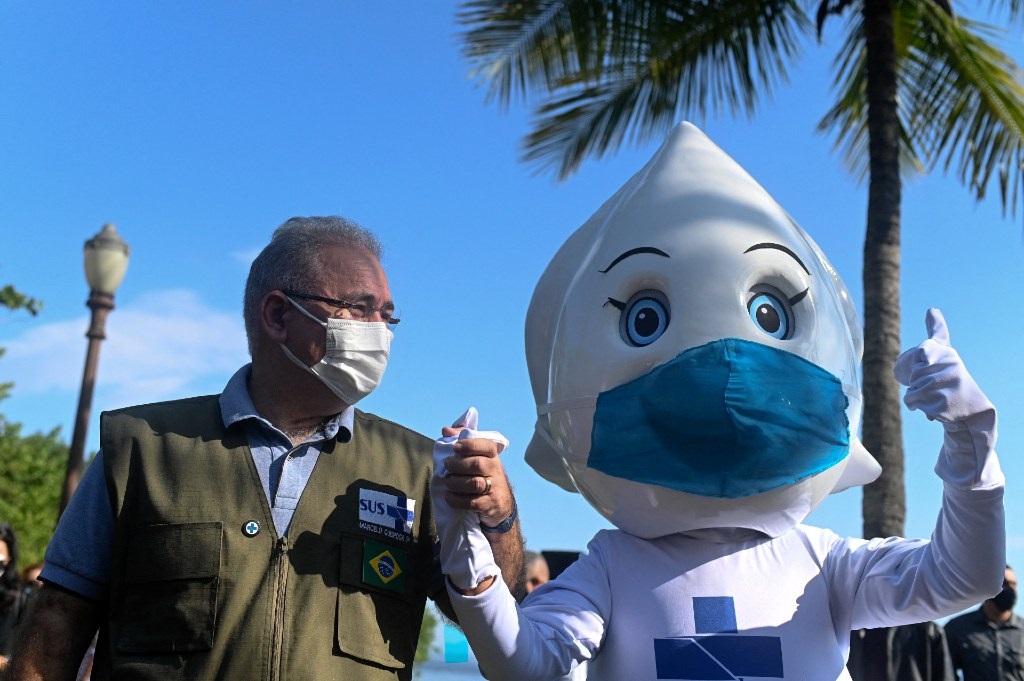 Brazil's health minister Marcelo Queiroga with a m