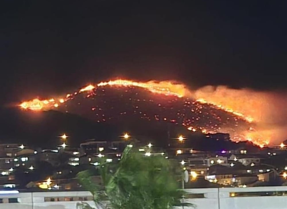Firefighters are trying to extinguish a fire that started on Friday night on the mountain slopes at Devil's Peak in Cape Town. (SANParks/Supplied)