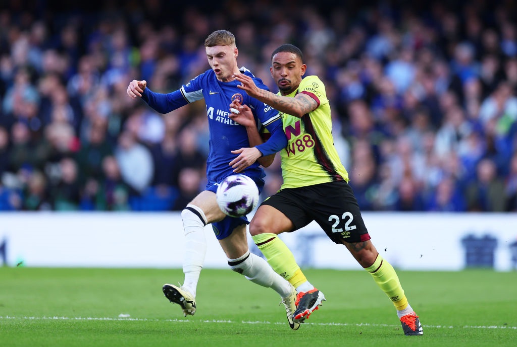 LONDON, ENGLAND - MARCH 30: Cole Palmer of Chelsea and Vitinho of Burnley battle for possession during the Premier League match between Chelsea FC and Burnley FC at Stamford Bridge on March 30, 2024 in London, England. (Photo by Richard Pelham/Getty Images)