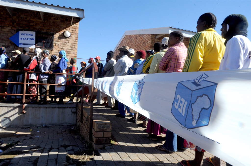 KIMBERLEY, SOUTH AFRICA ? 18 May 2011: Residents of the Platfontein community of the !Xhu and Khwe stand in long queues at a voting station in Kimberley, South Africa, on 18 May 2011 to cast their votes in the municipal elections. IEC official had to assist as communication proved to be a problem. (Photo by Gallo Images/Foto24/Emile Hendricks)