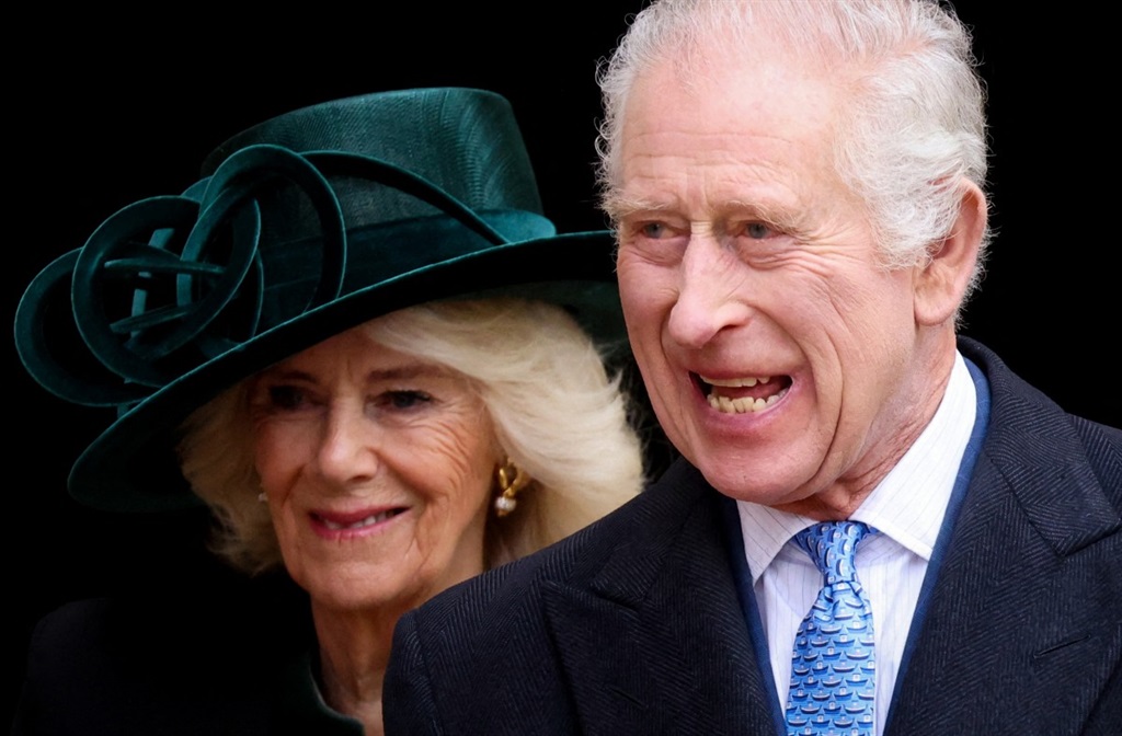Britain's King Charles III (front R), followed by Britain's Queen Camilla (rear L), reacts as he leaves St. George's Chapel, in Windsor Castle, after attending the Easter Mattins Service, on March 31, 2024.
