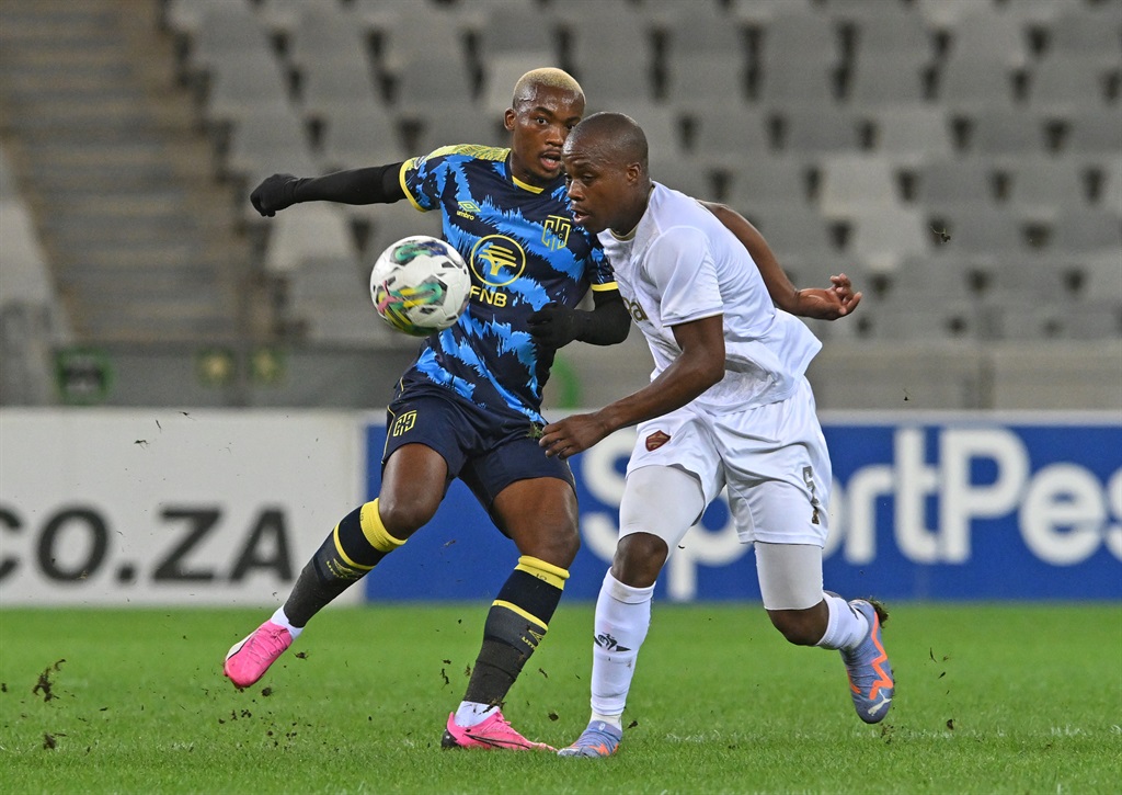 Khanyisa Mayo of Cape Town City is tackled by Darrel Matsheke of Stellenbosch FC during the DStv Premiership 2023/24 game between Cape Town City and Stellenbosch FC at Cape Town Stadium on 5 March 2024 