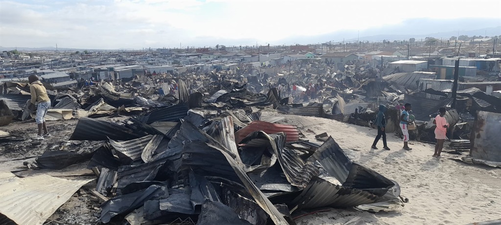Residents from Mfuleni are homeless after the fire destroyed their shacks. Photo by Lulekwa Mbadamane