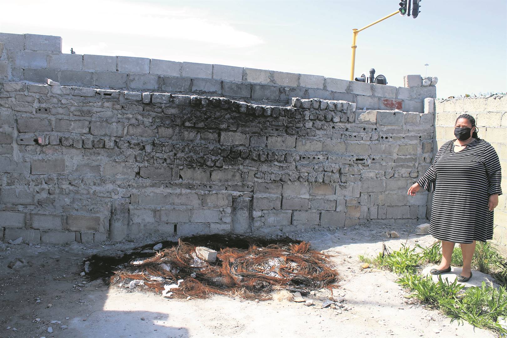 The wall built to protect the community from criminals. The passage they closed was linking their area to Site C in Khayelitsha and also Driftsand: Photo By Lindile Mbontsi Photo by 