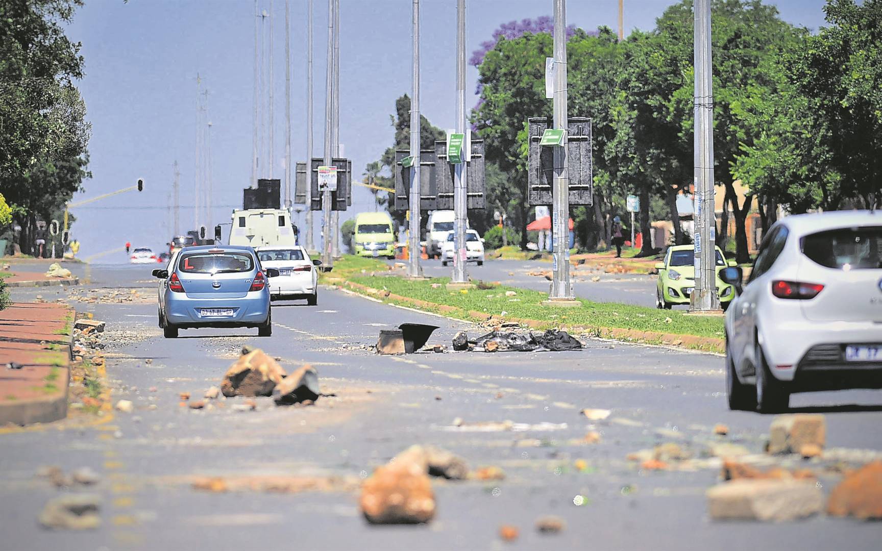 Residents of Dlamini and Senaoane barricaded Chris Hani Road with bricks and tyres protesting for electricity on voting day. Photo: Lucky Morajane