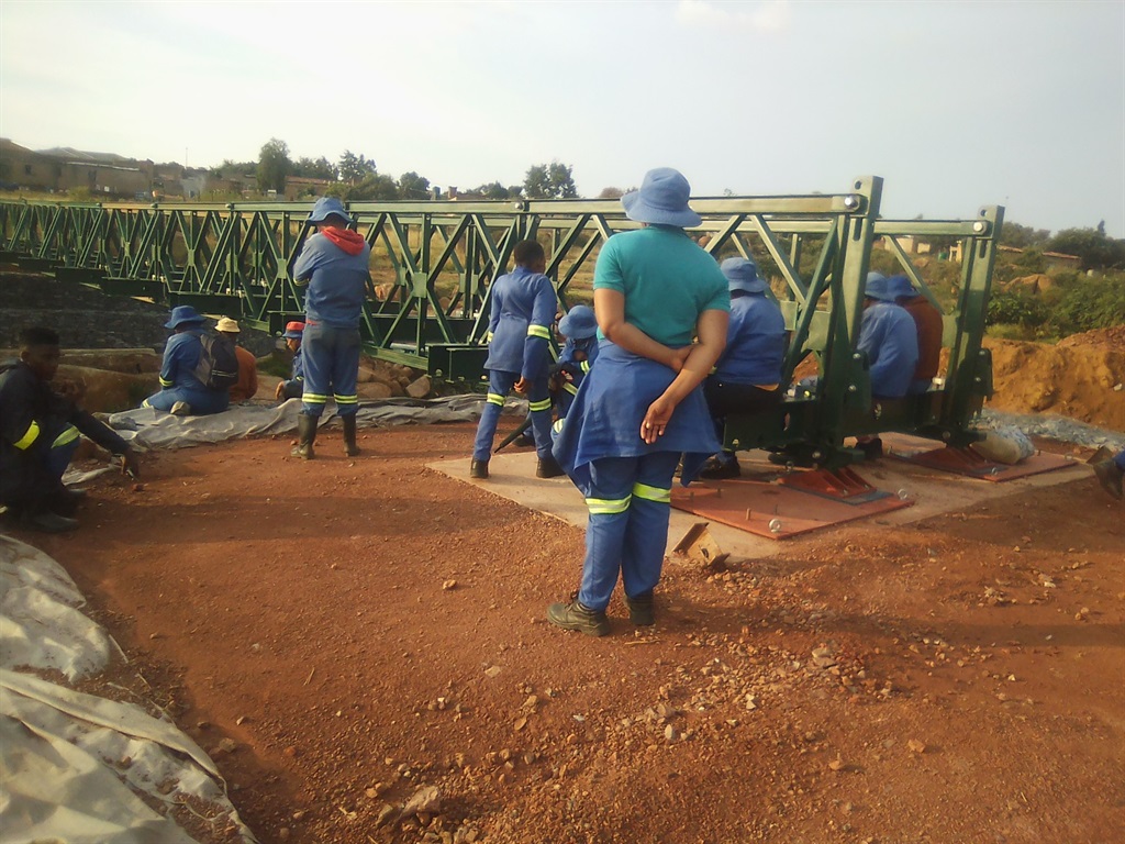 Footbridge construction workers have downed tools until their demands are met. Photo by Bongani Mthimunye