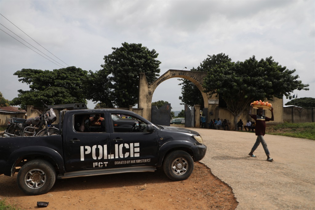 A police truck is stationed outside the University of Abuja Staff Quarters gate where unknown gunmen kidnapped people amongst whom were 2 of the university professors, lecturers and their family members in Abuja, Nigeria on November 2, 2021.