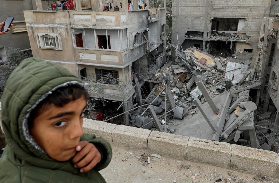 A Palestinian boy reacts near the site of an Israeli strike on a house, amid the ongoing conflict between Israel and the Palestinian Islamist group Hamas, in Rafah, in the southern Gaza Strip. Photo by Reuters