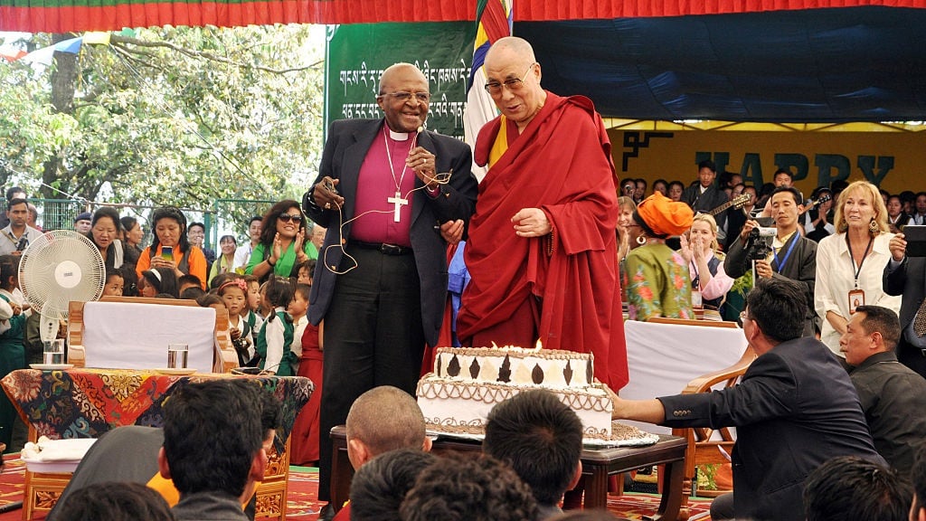 The Dalai Lama joins Archbishop Desmond Tutu for his birthday in 2015. (Getty Images)