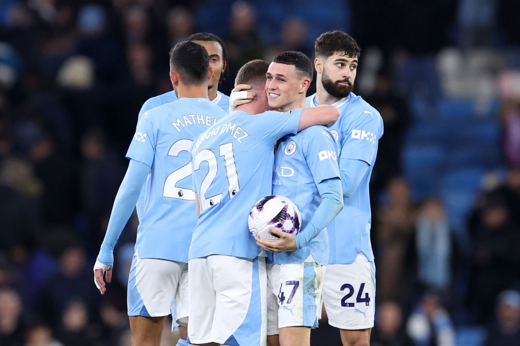 MANCHESTER, ENGLAND - APRIL 03: Phil Foden of Manchester City celebrates victory on pitch with the match ball after scoring a hat-trick during the Premier League match between Manchester City and Aston Villa at Etihad Stadium on April 03, 2024 in Manchester, England. (Photo by Alex Livesey/Getty Images)