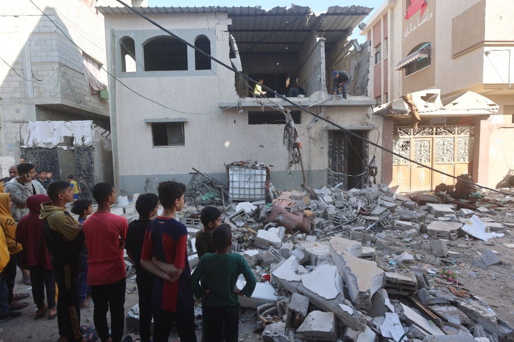 Palestinian children inspect the area after an Israeli attack on the Jenin neighborhood in Rafah, Gaza on 4 April 2024. (Ahmed Zaqout/Anadolu via Getty Images)