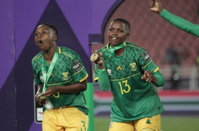Bambanani Mbane, pictured alongside Bongeka Gamede, has worn many titles, including being African champions with Banyana Banyana, but it's the title she got off the pitch that has inspired her to do well for the team. 
(Tobi Adepoju/Gallo Images)