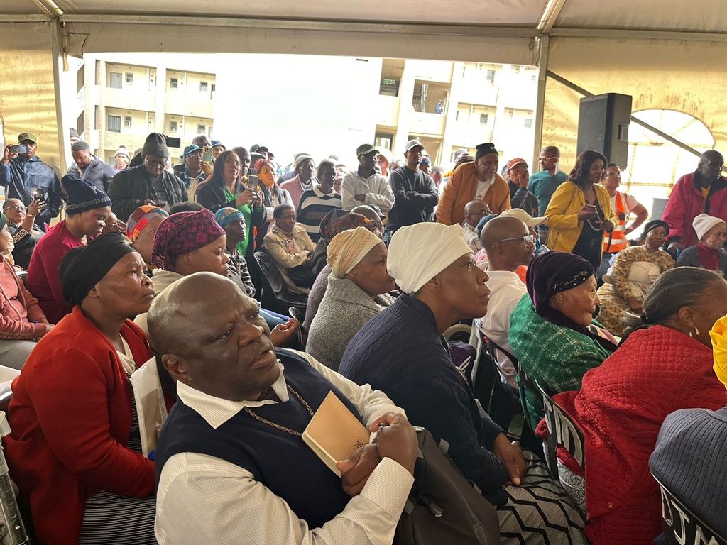 Fleurhof residents gather to receive their title deeds. Photos by Nhlanhla Khomola
