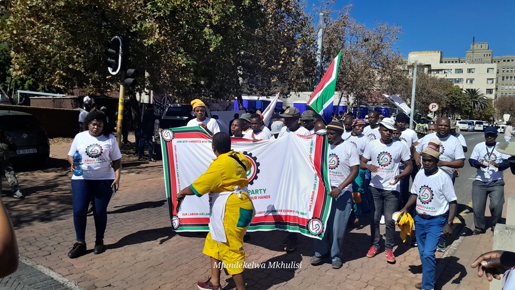 Three political parties that were barred from participating in the upcoming elections protested outside the Constitutional Court. Photo by Mfundekelwa Mkhulisi