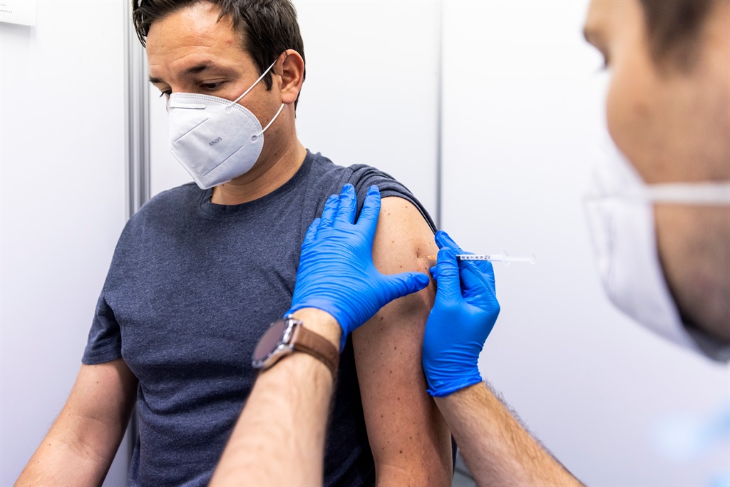 INNSBRUCK, AUSTRIA - NOVEMBER 08: A man receives his second vaccination at a vaccination center on November 08, 2021 in Innsbruck, Austria. (Photo by Jan Hetfleisch/Getty Images)